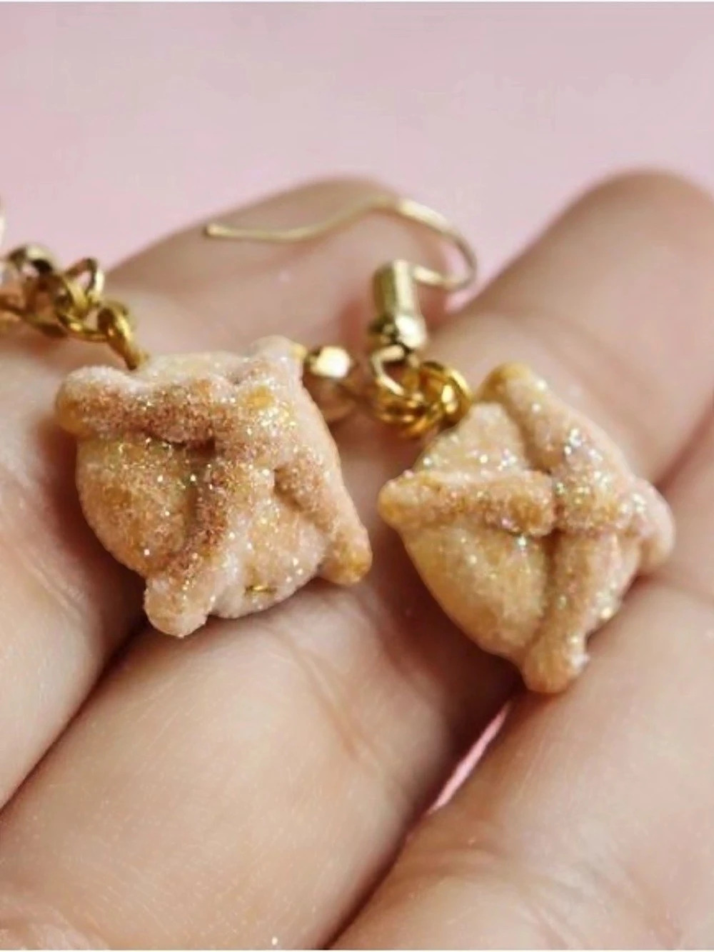 Handmade *pan de muerto*-shaped earrings.